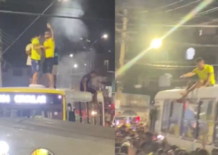 Mesmo sem gols do Brasil, torcedores festejam em cima de ônibus em Manaus