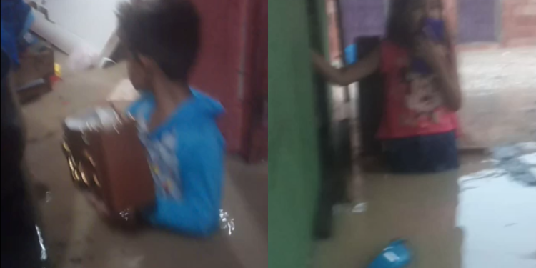 Vídeo: Com água ‘batendo no peito’, pai pede socorro para tirar filhos de dentro de casa