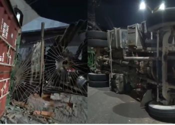 Uma carreta desgovernada acabou atingindo um muro de uma casa e dois carros que estavam na garagem. Carreta desgovernada