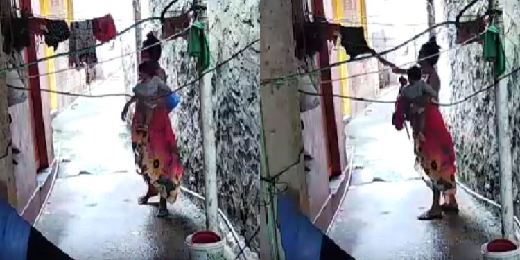 Câmera registra mulher com bebê que fica furtando roupas de varal em Manaus; veja