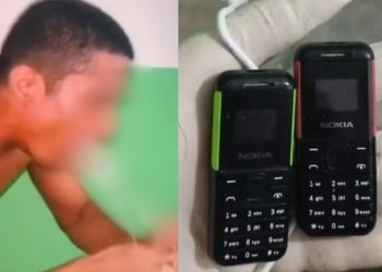 Detento tira da boca dois celulares e cabo USB