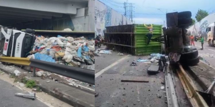 Motorista foge após tombar carreta com entulhos na Avenida das Flores