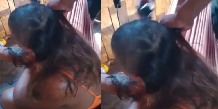Vídeo chocante: cabeça de mulher é raspada por causa de suposta traição